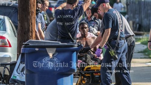 The wounded man, whose name was not released, was expected to be booked into the Fulton County Jail on a battery charge after he was released from a hospital.
