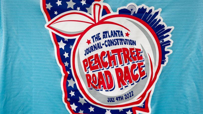 The award-winning T-shirt design for the 2022 Peachtree Road Race is displayed at the Atlanta Track Club on Wednesday, June 29, 2022. (Arvin Temkar / arvin.temkar@ajc.com)