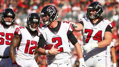 Falcons quarterback Matt Ryan celebrates with offensive tackle Ty Sambrailo (74) after catching a touchdown pass from wide receiver Mohamed Sanu in the third quarter Dec. 30, 2018, at Raymond James Stadium in Tampa, Fla.