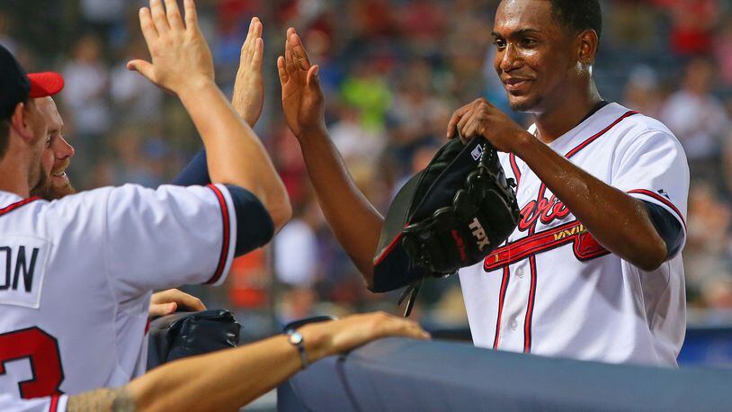 Julio Teheran pitched 8 1/3 innings against the Twins. He was congratulated by teammates as he left the game on Monday, May 20, 2013, in Atlanta.