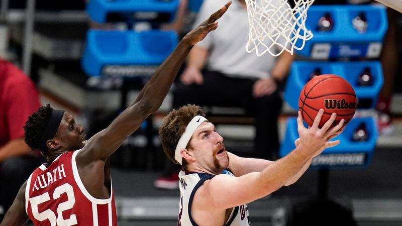 Gonzaga forward Drew Timme (2) shoots in front of Oklahoma forward Kur Kuath (52) in the first half of a second-round game in the NCAA men's college basketball tournament at Hinkle Fieldhouse in Indianapolis, Monday, March 22, 2021. (AP Photo/Michael Conroy)