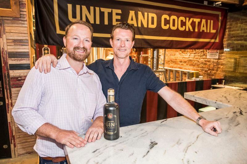 Old Fourth Distillery founders Craig and Jeff Moore with their new collaboration bottle.