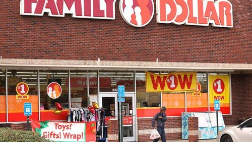 A customer leaves the Family Dollar at the intersection of Covington Highway and DeKalb Medical Parkway in Lithonia on Dec. 16, 2019. Three different dollar stores are located at that intersection. The city of Stonecrest has passed a measure banning new dollar stores from coming to the city, with leaders arguing that the stores project a negative image. (Curtis Compton/ccompton@ajc.com)