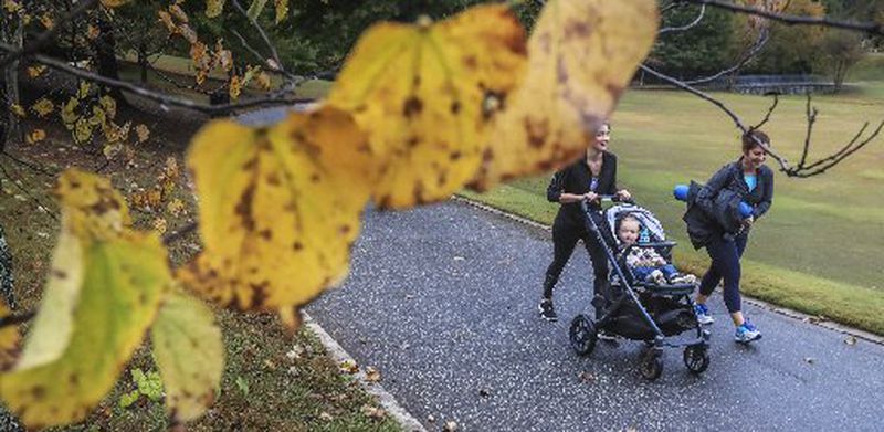Abigail Abt and her 1-year-old son William were joined by Sarah Corcoran for a walk in Piedmont Park on Friday. JOHN SPINK / JSPINK@AJC.COM