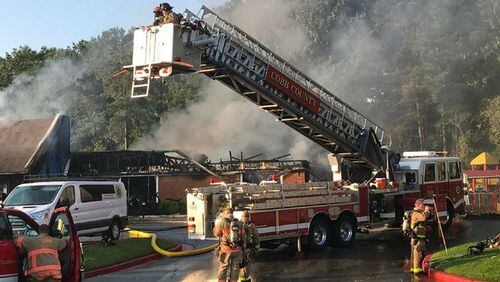 Cobb County firefighters battle a blaze at a day-care facility in Kennesaw.