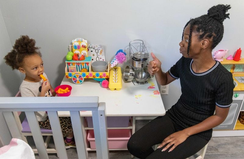 Tannyetta Robinson plays with her 4-year-old daughter Ayla in their Atlanta townhouse. PHIL SKINNER FOR THE ATLANTA JOURNAL-CONSTITUTION