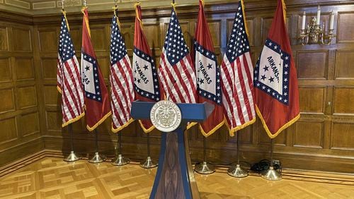 A blue and wood-paneled lectern sits in the governor's conference room at the Arkansas State Capitol on Tuesday, April 16, 2024. An audit requested by lawmakers said the $19,000 lectern purchased for Gov. Sarah Huckabee Sanders' office potentially violated several state laws. Sanders' office has disputed the audit's findings and called the audit deeply flawed. (AP Photo/Andrew DeMillo)