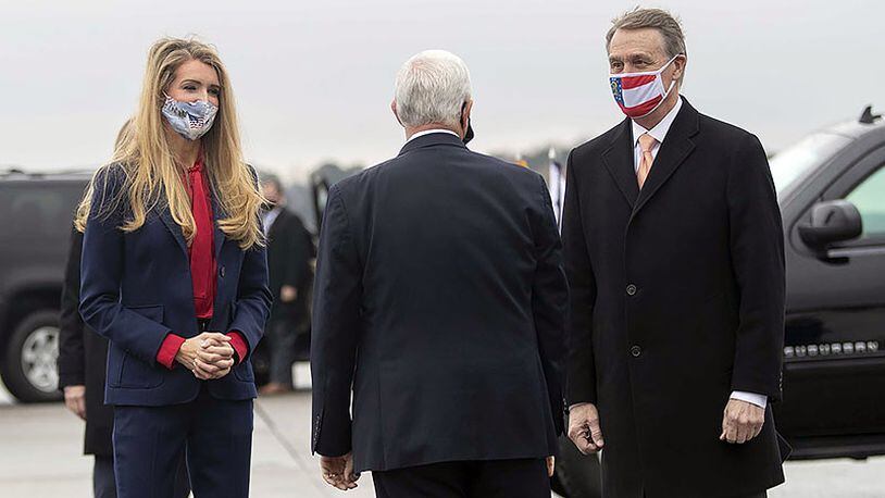 Georgia Sens. David Perdue, right, and Kelly Loeffler have filed a lawsuit seeking to eliminate what they say is double-voting in the upcoming runoff election.  (Alyssa Pointer/Atlanta Journal-Constitution/TNS)