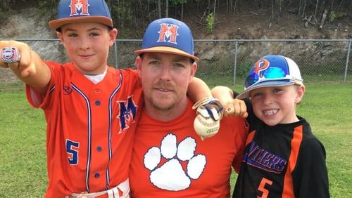 Brandon Wilson (center) drowned in Lake Hartwell on Saturday. He is survived by his two sons, Pierce (left) and Garrett, and his wife Jenny.