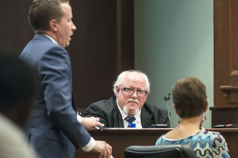 7/25/2019 -- McDonough, Georgia -- Dr. Kris Sperry (center) is cross-examined by DeKalb County Assistant District Attorney Edward Chase (left) during the trial of Jennifer and Joseph Rosenbaum in front of Henry County Judge Brian Amero at the Henry County Superior courthouse, Thursday, July 25, 2019.  (Alyssa Pointer/alyssa.pointer@ajc.com)