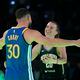 Golden State Warriors guard Stephen Curry hugs New York Liberty guard Sabrina Ionescu after Curry won their competition at the NBA basketball All-Star weekend, Saturday, Feb. 17, 2024, in Indianapolis. (AP Photo/Darron Cummings)
