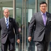 U.S. Attorney Byung J. “BJay” Pak, (right) in August, leaving the federal building to speak to the media after hearings on charges against former city of Atlanta officials. BOB ANDRES /BANDRES@AJC.COM
