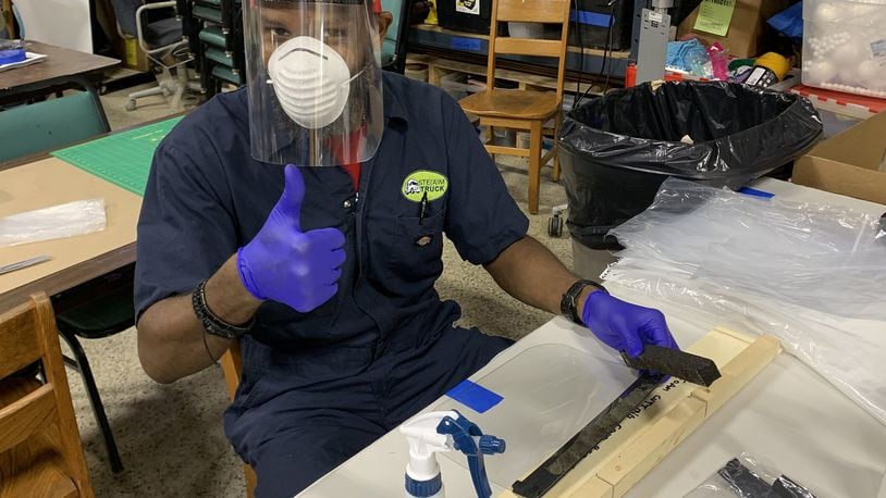 Kelvin Smith, a volunteer with Atlanta Beats Covid, works in the Decatur Makers makerspace to produce face shields that will be donated to Atlanta area healthcare workers. Contributed