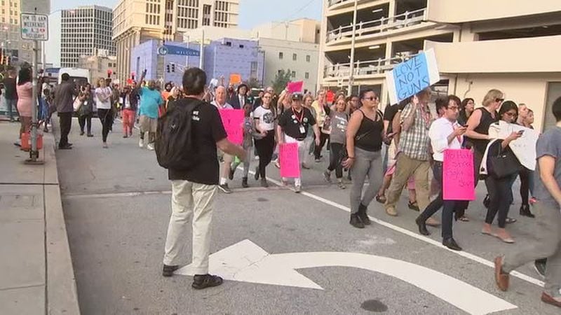 Hundreds of people marched Sunday night in Atlanta to protest violence in Charlottesville, Virginia. (Credit: Channel 2 Action News)