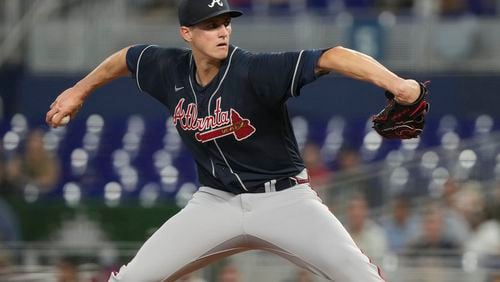 Atlanta Braves starting pitcher Kyle Wright (30) aims a pitch during the third inning of a baseball game against the Miami Marlins, Wednesday, May 3, 2023, in Miami. (AP Photo/Marta Lavandier)