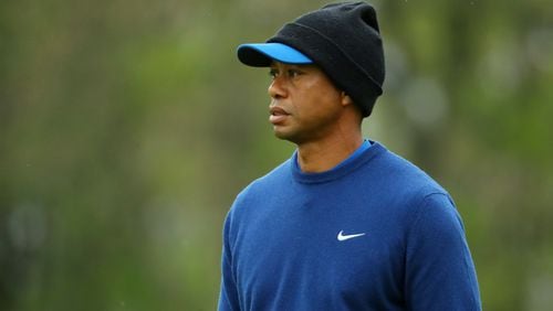 A PGA Championship in May in New York can be a chilly proposition - note Tiger Woods during an early-week practice round. But it's expected to heat up once the real competition begins. (Photo by Warren Little/Getty Images)