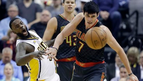 Indiana Pacers’ Lance Stephenson and Atlanta Hawks’ Ersan Ilyasova eye a loose ball during the first half of an NBA basketball game Wednesday, April 12, 2017, in Indianapolis. (AP Photo/Darron Cummings)