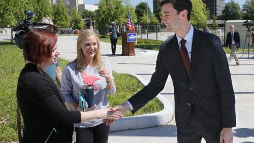 Democrat Jon Ossoff shakes hands with supporters Wednesday after he held a press conference in Liberty Plaza, across from the Capitol. Saying that “cutting waste is simply not a partisan issue,” Ossoff made a pitch to reduce federal spending by $16 billion BOB ANDRES /BANDRES@AJC.COM