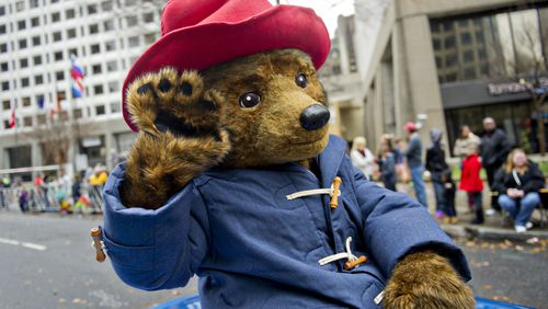 December 6, 2014 Atlanta - Paddington Bear waves to the crowd during the 2014 Children's Christmas Parade in Atlanta on Saturday, December 6, 2014. Thousands of people braved the inclement weather to watch the parade as it made its way down Peachtree St. JONATHAN PHILLIPS / SPECIAL