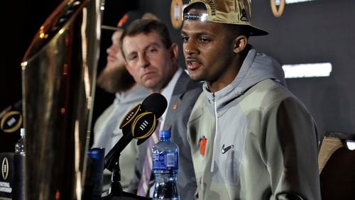 Clemson quarterback Deshaun Watson, right, answers a question during a news conference Tuesday, Jan. 10, 2017, in Tampa, Fla. Clemson defeated Alabama 35-31 in the College Football Playoff championship game the night before. Looking on at left is coach Dabo Swinney. (AP Photo/Chris O’Meara)