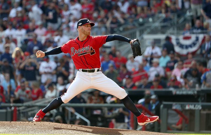 Braves starting pitcher Mike Foltynewicz delivers to a St. Louis Cardinals batter during Game 2 of the NLDS at SunTrust Park Friday, October 4, 2019 in Atlanta. (JASON GETZ/SPECIAL TO THE AJC)