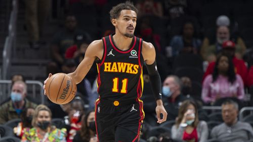 Trae Young dribbles up the court during the first half of Monday's Wizards-Hawks game at State Farm Arena in Atlanta. (AP Photo/Hakim Wright Sr.)