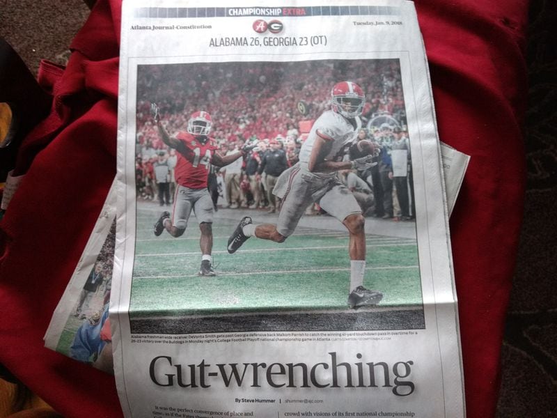 AJC multimedia journalist Curtis Compton took the picture of Alabama’s game-winning catch, once again capturing an historic moment. His photo dominated the first page of the AJC’s sports section the next morning