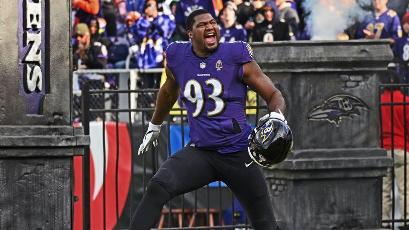 Baltimore Ravens defensive end Calais Campbell runs onto the field before a game against the Denver Broncos on Dec. 4, 2022. (Kenneth K. Lam/The Baltimore Sun/TNS)