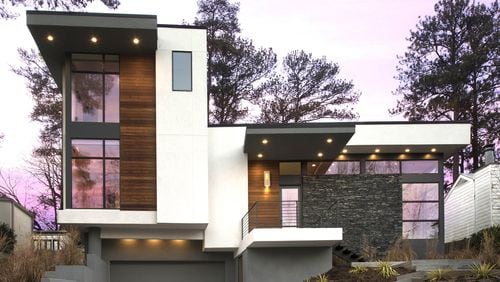 The custom design of the Spring Valley home was inspired by the owners’ love of cantilevers, angles and levels. The home’s exterior consists of a combination of stucco, Ipe wood veneer and natural stone. Contributed by Galina Coada