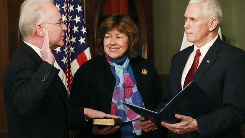 Vice President Mike Pence, right, administers the oath of office to Tom Price, as his wife, Betty, holds a Bible, to become the secretary of health and human services. Price now heads a department with a budget of roughly $1 trillion and oversees programs such as Medicare, the Atlanta-based Centers for Disease Control and Prevention, and food safety. It makes a meeting with Price one of the most desirable tickets in Washington for a large number of interest groups. (Photo by Mark Wilson/Getty Images)