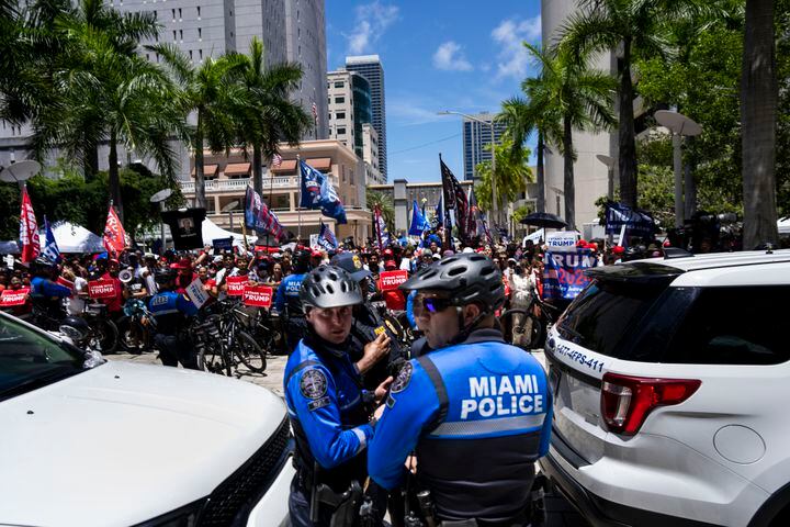 Miami Police watch over supporters of former President Donald Trump outside the Wilkie D. Ferguson Jr. U.S. Courthouse while Trump was making his first court appearance inside in Miami, June 13, 2023. (Doug Mills/The New York Times)