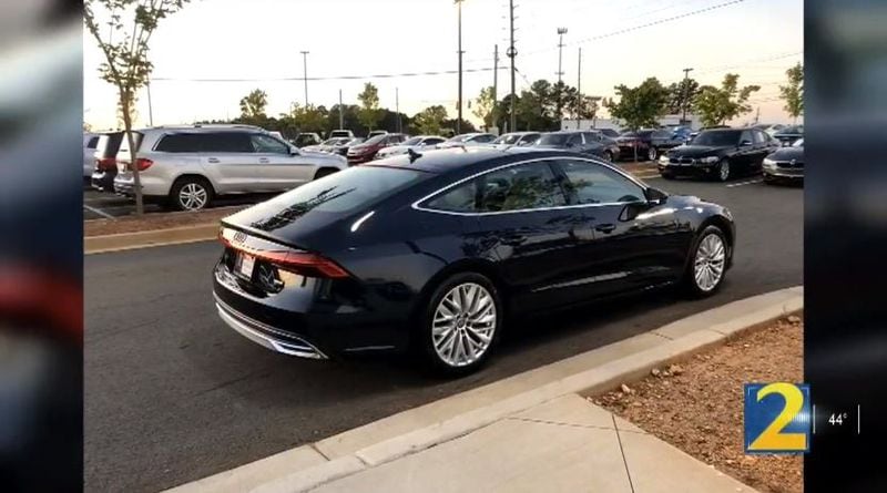 A woman had her luxury car stolen Tuesday evening after getting-rear ended at a busy Atlanta intersection, authorities said.