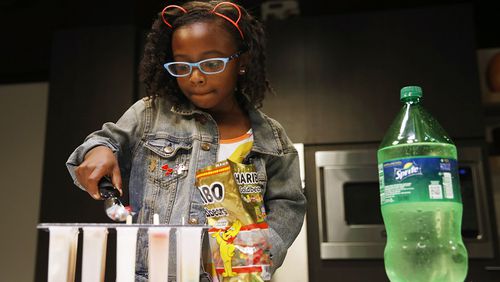 Ellington Young, 7, makes a gummy bear and lemon lime soda popsicle in the studio in Dallas on Friday, June 7, 2018. (Vernon Bryant/The Dallas Morning News/TNS)