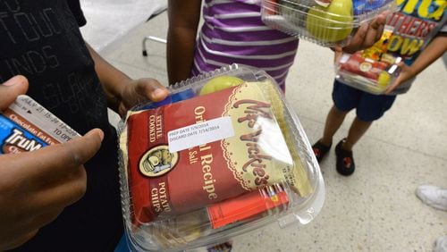 The DeKalb County School District’s Nutrition Services department is offering meals on Mondays, Wednesdays and Fridays to all children up to 18 years old. Families can pick up the food from 11 a.m. to 1 p.m. HYOSUB SHIN / HSHIN@AJC.COM