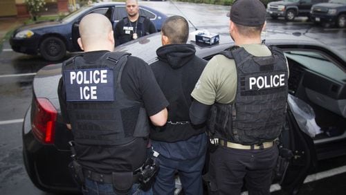 Photo released by U.S. Immigration and Customs Enforcement shows foreign nationals being arrested in Los Angeles in early February. This was the beginning of a nationwide action, which included Atlanta, in which nearly 700 people were arrested.