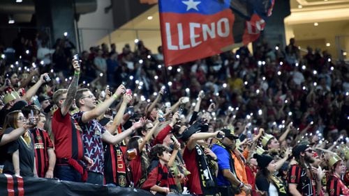 October 24, 2019 Atlanta - Atlanta United fans cheer for their team as they hold lights in the second half during Eastern Conference semifinals of MLS playoffs at Mercedes-Benz Stadium on Thursday, October 24, 2019. Atlanta United won 2-0 over the Philadelphia Union. (Hyosub Shin / Hyosub.Shin@ajc.com)