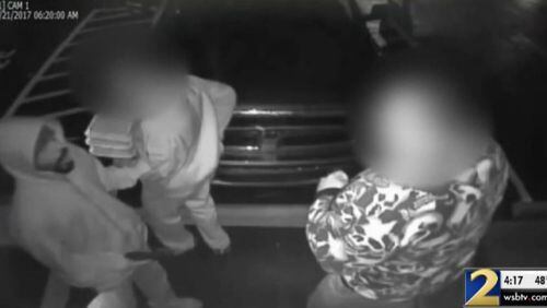 Surveillance video shows the man (left), who police say robbed the Rumors gentleman’s club in Forest Park.