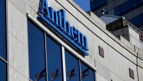 Anthem, the parent company of Blue Cross Blue Shield of Georgia, has been sued by Piedmont Hospital and five sister facilities. Shown here, the Anthem logo hangs at the health insurer’s corporate headquarters in Indianapolis. (AP Photo/Michael Conroy, File)