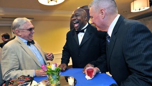 2014 Inductee George Rogers (center) talks with guests Bill Knox (left) and Frank Boyd before the Atlanta Sports Hall of Fame 10th Anniversary induction ceremony at Buckhead Theater in Atlanta on Friday, February 7, 2014. HYOSUB SHIN / HSHIN@AJC.COM