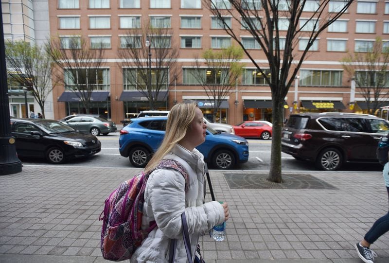 Alex Goodman walks to her dormitory after class at Georgia Tech’s Scheller College of Business as a part of the EXCEL program for students with intellectual disabilities. 