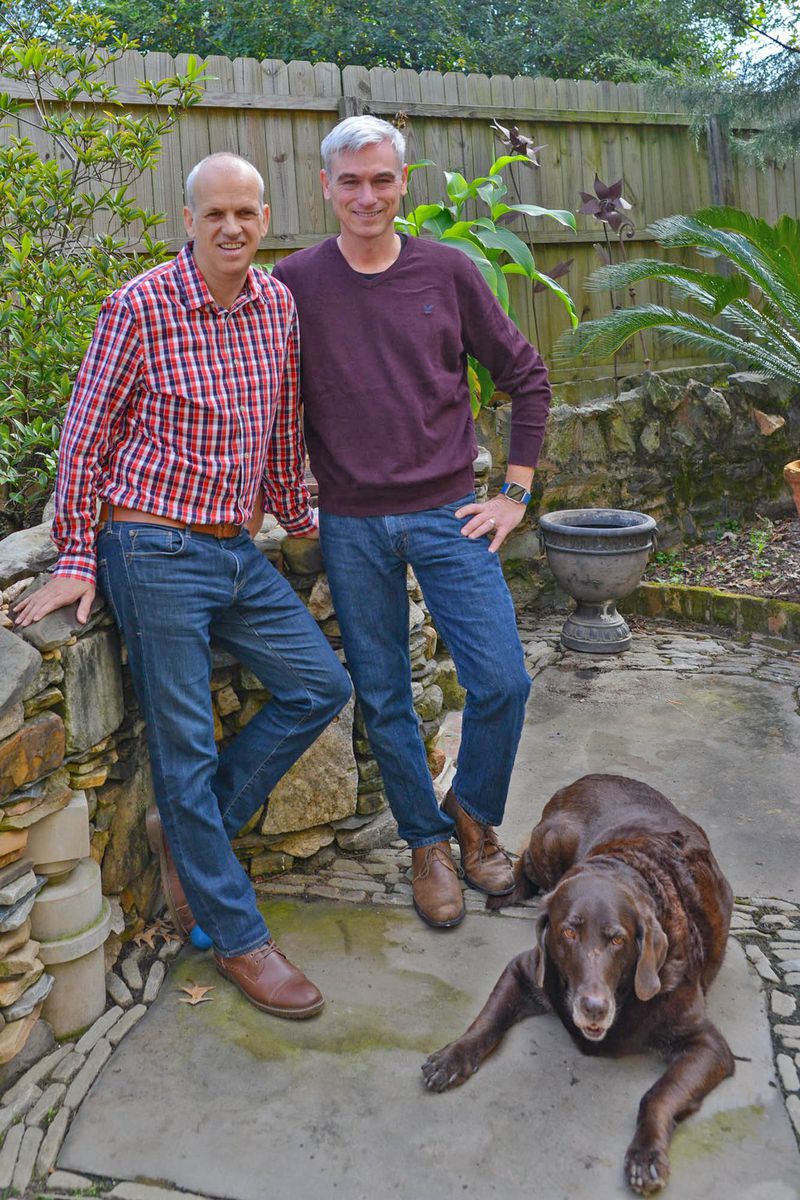 Leon Kouters (left), works for Fokker Services, an aerospace company, and Marty Simpson (right), who works for Enterprise Holdings, bought their five-bedroom Grant Park home in 2017. They live in the 3,200-square-foot, Victorian home with their son, Colin, a college student, and their chocolate lab, Tanner. The home is on the 2017 Grant Park Candlelight Tour of Homes, set for Dec. 9-10. Text by Anna Logan and Lori Johnston/Fast Copy News Service. (Christopher Oquendo/www.ophotography.com)