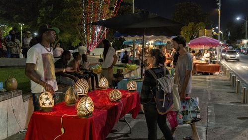 A Friday night market in Le Gosier, Guadeloupe, Jan., 2017. Vendors displayed both handicrafts and produce, including bulbous pumpkins, speckled watermelons, wild greens, homemade medications, dried spices, curls of cinnamon bark and vanilla beans. (Rolando Diaz/The New York Times)