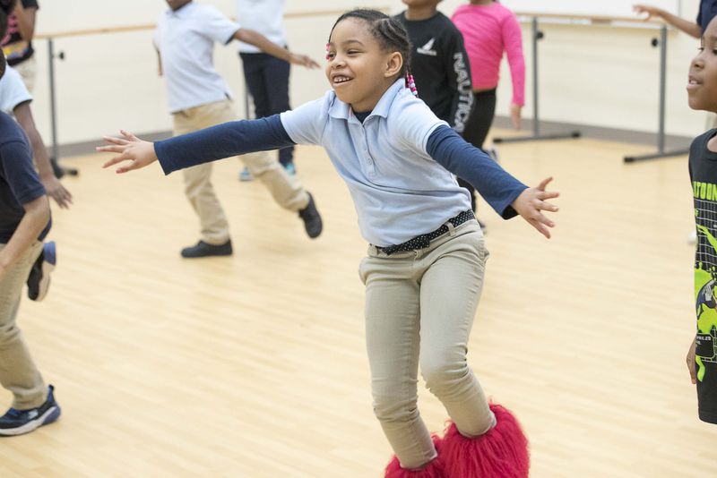 Harper-Archer Elementary School second grader Kimora Parker practices a dance move that was recently added to her classes' African themed routine during class inside the school's dance studio Tuesday, January 28, 2020. (ALYSSA POINTER/ALYSSA.POINTER@AJC.COM)