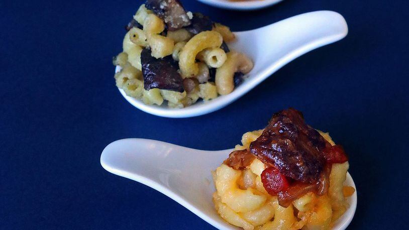 Four macaroni and cheese offerings with different toppings are photographed on Wednesday, Jan. 17, 2018. From the bottom up: Mac and cheese with Buffalo Chicken Topping, Mac and cheese with a Five-Spice Beef Topping, Wild Mushroom Macaroni and Cheese and Mac and cheese with a Barbecued Brisket Topping. (Christian Gooden/St. Louis Post-Dispatch/TNS)