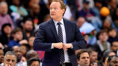 Atlanta Hawks coach Mike Budenholzer gestures during the second half of the team's NBA basketball game against the Washington Wizards, Friday, April 6, 2018, in Washington. The Hawks won 103-97. (AP Photo/Nick Wass)