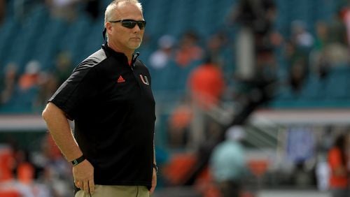 Miami's Mark Richt alone with his thoughts earlier this month vs. Virginia. (Mike Ehrmann/Getty Images)
