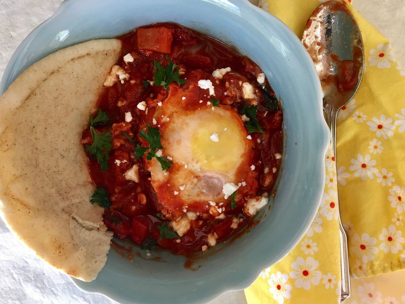 Shakshuka is traditionally served with pita bread or crusty baguettes. CONTRIBUTED BY KELLIE HYNES
