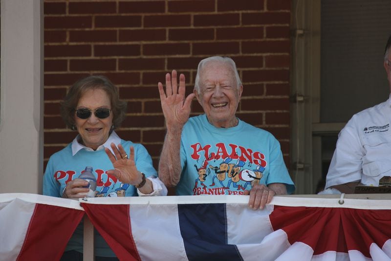 Rosalynn and Jimmy Carter wave from the balcony of the Plains Historic Inn during the Peanut Festival parade on Saturday, Sept. 23, 2017. Photo by Jill Stuckey