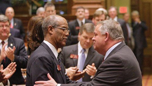 Newly elected speaker David Ralston (right), a Republican from north Georgia, and Rep. Calvin Smyre, the Democratic nominee for the post, exchange greetings during Ralston's official escort into the chamber.