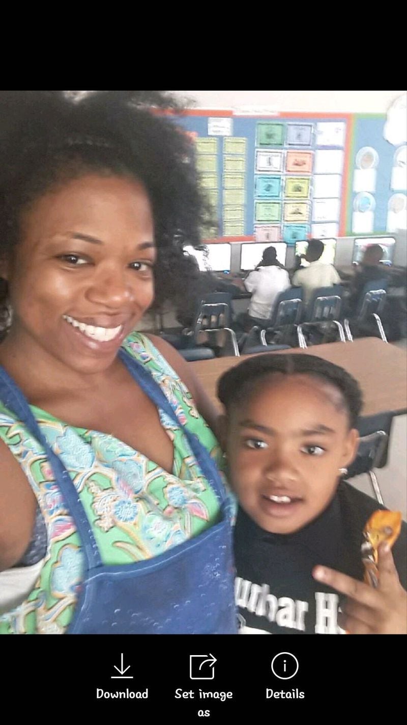 Dunbar Elementary School teacher Joya Florence takes photos with her former student Secoriea Turner. Secoriea was fatally shot Saturday night, July 4, 2020 in Atlanta. 